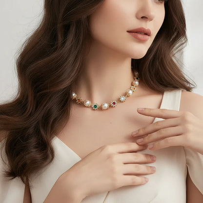 Close-up of woman wearing a pearl and colorful gemstone floral necklace with white dress