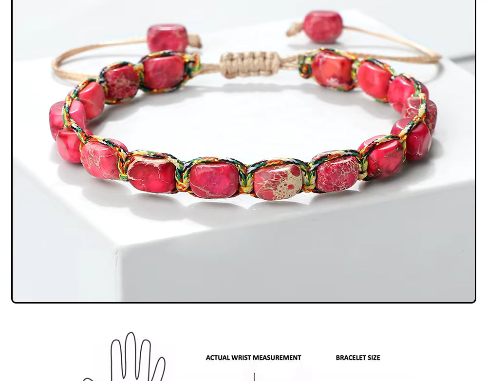 Handmade red stone bead bracelet with adjustable beige cord and multicolor thread accents